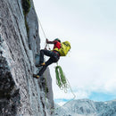 Osprey Mutant 38 Backpack worn rock climbing, lifestyle shot