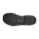 The Salomon Womens Quest 5 GORE-TEX Hiking Boot features a rugged black sole with deep grooves, angular lugs, and a red triangular detail—ideal for demanding hikes in waterproof comfort.