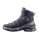The Salomon Womens Quest 5 GORE-TEX Hiking Boot features a dark gray high-top design with black and yellow accents, rugged sole, reinforced toe, padded ankle support, and waterproof materials for superior outdoor performance.