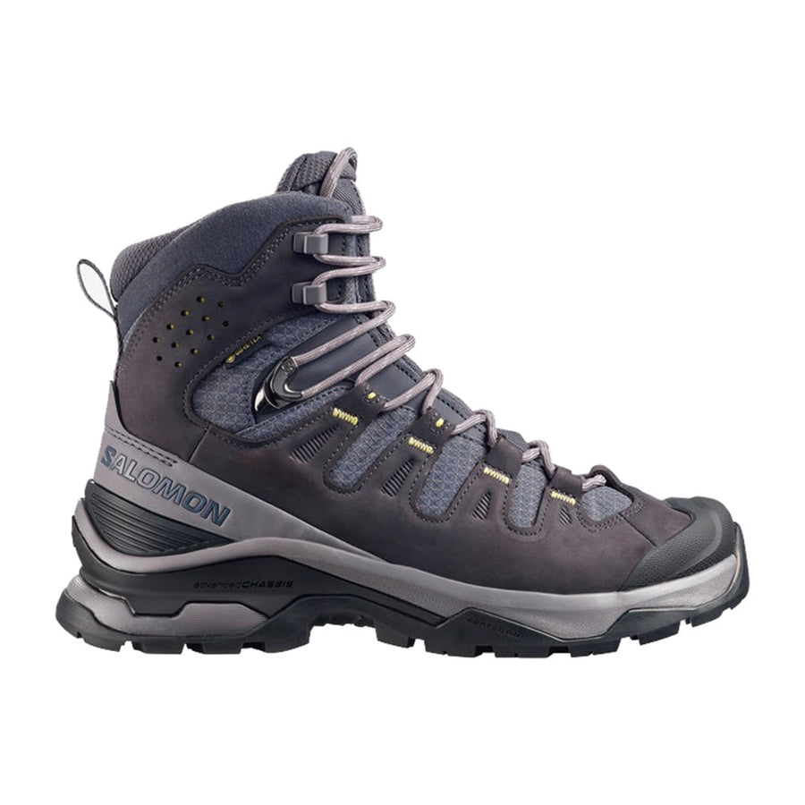 The Salomon Womens Quest 5 GORE-TEX Hiking Boot is shown in side profile against a white background, featuring dark gray waterproof material, a high ankle, rugged sole, sturdy laces, and a reinforced toe.