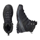The Salomon Men’s Quest 5 GORE-TEX Hiking Boot, shown from top and side views, features rugged soles, 4D Advanced Chassis, metal eyelets, and padded collars—ideal for outdoor adventures.