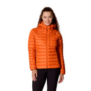 A person wearing a bright orange Rab Womens Microlight Alpine Hoody and black pants stands smiling against a white background.