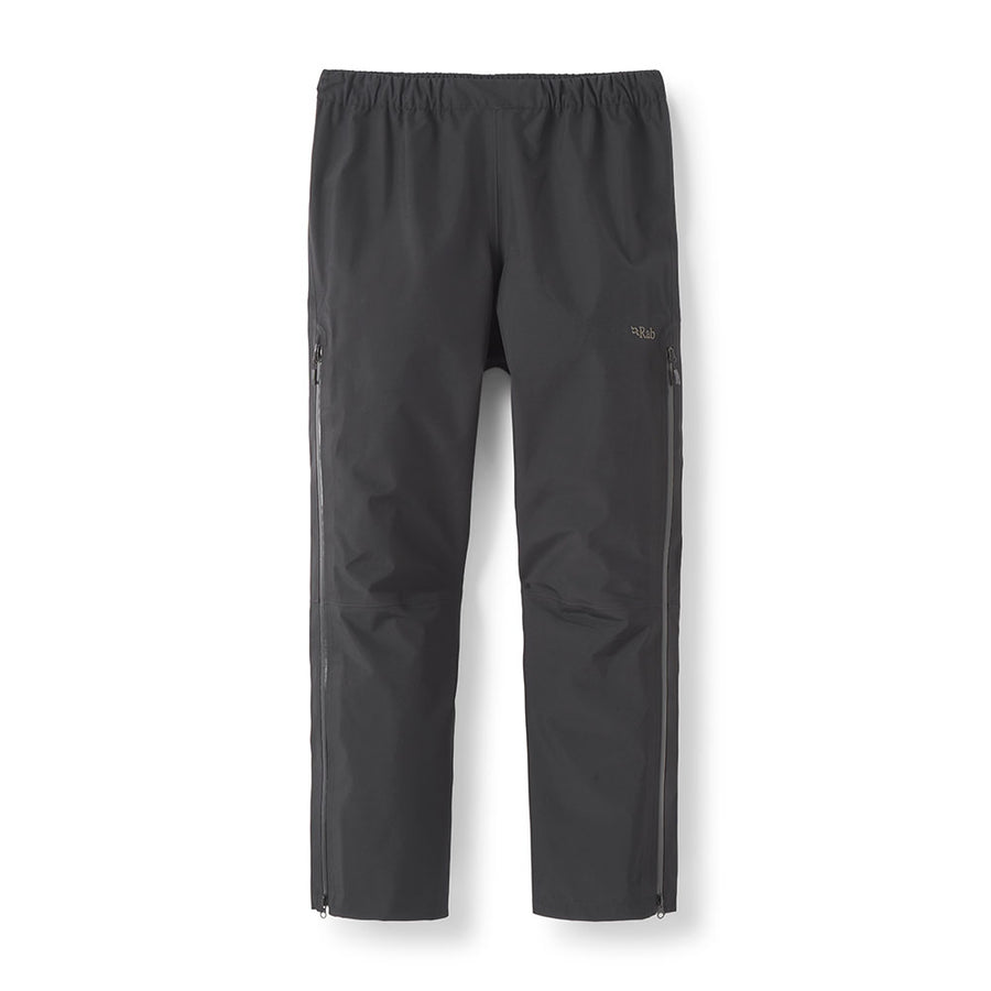 The Rab Womens Namche Hike GORE-TEX Pants are black waterproof trousers with an elastic waistband and zippered side pockets, shown against a white background. These hiking overtrousers feature full-length side zippers for easy on and off, making them ideal for wet weather adventures.