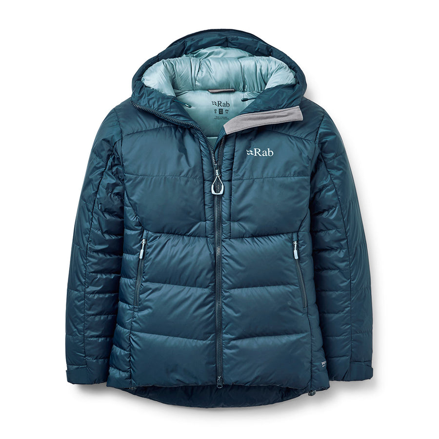 The Rab Women’s Positron Pro Down Jacket is a teal down jacket designed for women, featuring a hood, front zipper, and two zippered pockets. Filled with hydrophobic down for superior warmth and moisture resistance, it displays the Rab logo on the left chest. This jacket is ideal for cold weather or high-altitude expeditions.