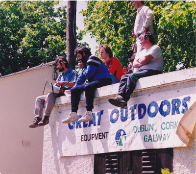 Great outdoors staff sitting on the roof with old brand assests 