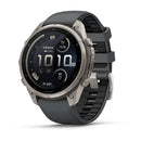 A silver and black Garmin fēnix 9 Pro inReach multisport GPS smartwatch features a round digital display presenting the time, date, steps, calories, and heart rate. It comes with a gray silicone band and a sturdy metal casing with visible screws, blending stylish design with the advanced performance and satellite connectivity you expect from Garmin.