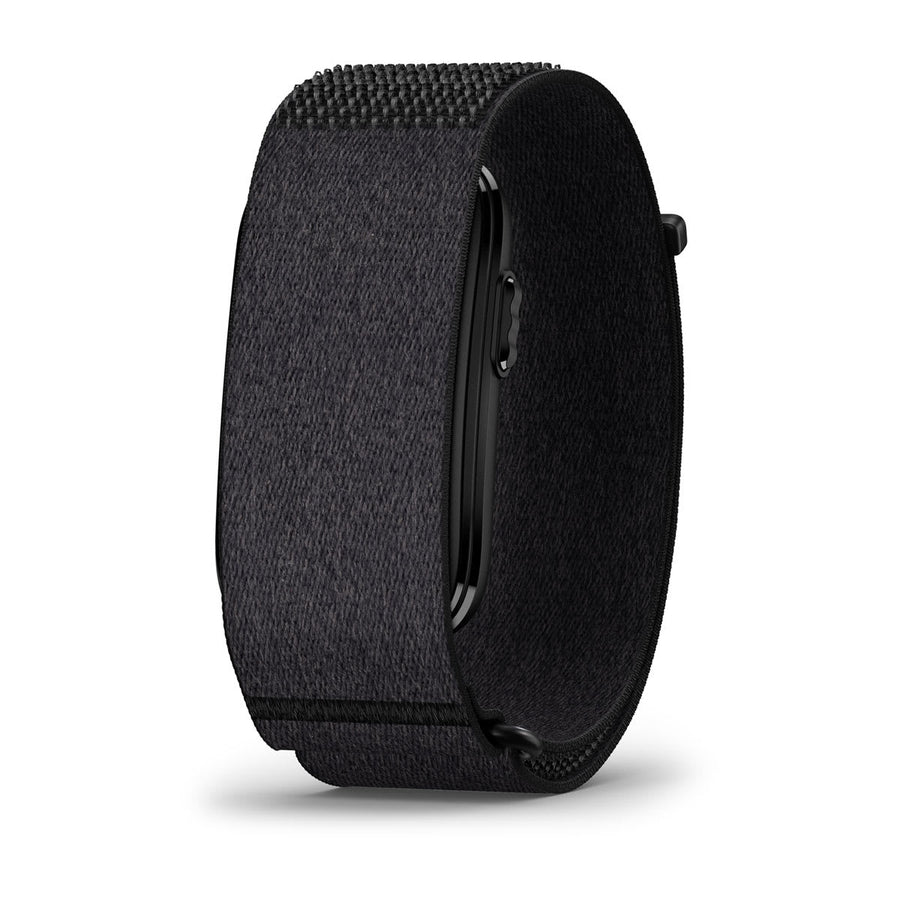 A side view of the Garmin CIRQA Smart Band is displayed on a white background, featuring a black textured fabric wristband with a loop fastener and a rectangular smartwatch face—perfect for comfortable 24/7 health monitoring and advanced sleep tracking.