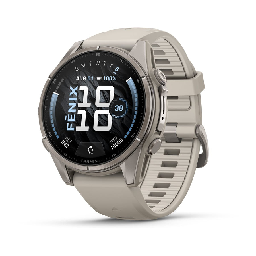 A Garmin fēnix 9 multisport GPS smartwatch in silver features a beige strap and shows time, date, battery level, steps, and fitness metrics on its round AMOLED display.