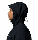 Person wearing a black raincoat with a hood on a white background