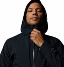 Person wearing a black hooded jacket on a white background