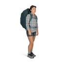 Osprey Fairview 70 Travel Pack worn, full length side profile, Cascade Blue/Teal Blue
