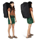 Osprey Farpoint Fairview Wheeled Travel Pack 65L worn, full length front, Black