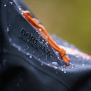 Close-up of a waterproof material with 'Oxford' branding on a blurred background
