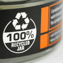 Close-up of a grangers wax jar with a 100% recycled label on a black background.