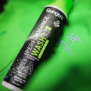 Grangers Performance Wash concentrate can on a green waterproof jacket background