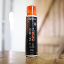 Grangers clothing repel can on a wooden surface with a blurred background