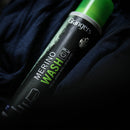 Grangers Merino Wash bottle on a dark fabric background