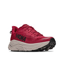 A side view of the Mens Challenger 8 Trail Running Shoe by Hoka, featuring a red and black upper, a thick light gray sole, and trail-ready tread, set against a white background.