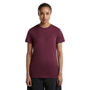 A woman wearing a dark maroon, short-sleeved, crew-neck Women’s 150 Tech Lite T-Shirt.