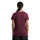 A person seen from the back wearing a short-sleeved, maroon Women’s 150 Tech Lite T-Shirt by Icebreaker.
