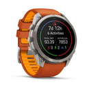A silver Garmin fēnix 9 Pro inReach multisport GPS smartwatch with an orange band presents comprehensive fitness stats—7 days, 12 hours tracked across 6 activities, covering a total distance of 93.39 and burning 7853 active calories. The vibrant display showcases colorful icons and data, emphasizing the device’s advanced tracking features and satellite connectivity for highly accurate performance insights.