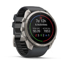 A gray Garmin fēnix 9 Pro inReach multisport GPS smartwatch with a black band displays fitness stats on its screen: 7 days 12 hours, 6 activities, total distance of 93.39, active calories burned (7853), along with icons for running, cycling, and swimming.