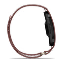 Side view of a black Garmin CIRQA Smart Band smartwatch with a brown, perforated leather strap and metal buckle, featuring 24/7 health monitoring, displayed against a white background.