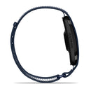 A side view of the Garmin CIRQA Smart Band with a dark blue woven strap and a black rectangular face, displaying the Garmin logo on the side. Designed for 24/7 health monitoring and advanced sleep tracking, the CIRQA Smart Band is standing upright on a white background.