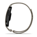 The Garmin CIRQA Smart Band is displayed in a side profile view, showcasing its sleek black body and single side button. Featuring a beige woven band with decorative loops along the edge, this stylish device is designed for 24/7 health monitoring and advanced sleep tracking.