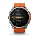 A multisport GPS smartwatch, the Garmin fēnix 9 Pro inReach with its vibrant orange band, displays activity options—MTB, Trail Run, Row Indoor (highlighted), Rucking, and Ski. The watch screen showcases clear icons and text for each activity, making it simple to track your progress across diverse workouts—just like with the new Garmin fēnix 9 Pro inReach featuring satellite connectivity.