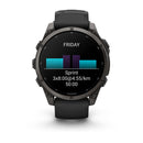 A black Garmin fēnix 9 multisport GPS smartwatch with a vibrant AMOLED display displays a workout screen featuring “FRIDAY,” a bar graph, “Sprint 3x8:00@4:55/km,” and “50:00” on a clean white background.