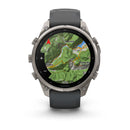 A Garmin fēnix 9 Pro inReach multisport GPS smartwatch displays a detailed topographic map with marked routes, rivers, and place names such as Livemone and Treviso. The watch features satellite connectivity, a dark band, and four side buttons.