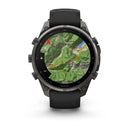 A black Garmin fēnix 9 Pro inReach multisport GPS smartwatch displays a detailed topographic map with terrain, a route, and place names such as Vestone, Lavenone, and Treviso Bre. The watch features a black band, multiple buttons, and advanced satellite connectivity for precise navigation wherever your adventures take you.
