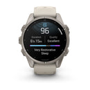 A Garmin fēnix 9 multisport GPS smartwatch with a beige band shows sleep data—including a 96 sleep score, 8 hours and 15 minutes of restful sleep, excellent quality, and a message that reads “Very Restorative Sleep.” The vibrant AMOLED display from the Garmin brand features subtle sleep-themed graphics in the background.