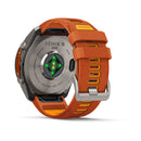 A Garmin fēnix 9 Pro inReach multisport GPS smartwatch featuring an orange and yellow band, displayed with the back view highlighting its sensors and charging port.