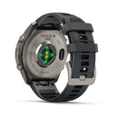 Rear view of the Garmin fēnix 9 Pro inReach multisport GPS smartwatch, featuring a dark silicone strap, durable titanium case, and glowing green health sensors on the back for heart rate monitoring—plus cutting-edge features such as satellite connectivity.