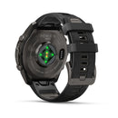 The back of a Garmin fēnix 9 Pro inReach multisport GPS smartwatch, featuring glowing green heart rate sensors, a black wristband, and a metal clasp.