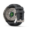 A Garmin fēnix 9 Pro inReach multisport GPS smartwatch is shown from the back, highlighting its sensor lights and a gray-black adjustable wristband with a metal buckle. The device showcases advanced features such as satellite connectivity, emphasizing Garmin’s robust design for versatile performance.