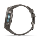 Side view of the rugged Garmin fēnix 9 multisport GPS smartwatch in gray, featuring a textured band and two metal side buttons, with an advanced AMOLED display, isolated on a white background.