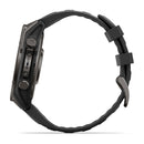 Side view of the Garmin fēnix 9 multisport GPS smartwatch in black, showcasing its round face, two buttons, rugged black strap with dual loops, and a vibrant AMOLED display for superior clarity.