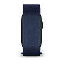 A dark blue CIRQA Smart Band from Garmin is attached to a black smartwatch, shown from the side with the band and watch edge visible against a white background. This stylish and comfortable accessory offers advanced sleep tracking and 24/7 health monitoring—perfect for those seeking both function and fashion.