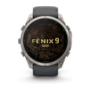 A Garmin fēnix 9 Pro inReach multisport GPS smartwatch with a black strap, featuring a gold topographic map design and the words “fēnix 9 Pro inReach” displayed on the screen.
