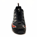 Front view of the Salomon Mens XA Pro 3D V9 GORE-TEX Trail Shoe in black and gray with red accents, black laces, and logo detailing, designed for technical terrain, shown on a plain white background.