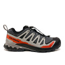 The Salomon Mens XA Pro 3D V9 GORE-TEX Trail Shoe is a single black, gray, and orange waterproof shoe with rugged soles for technical terrain, a quick-lace system, protective toe cap, and Salomon logo on the side.