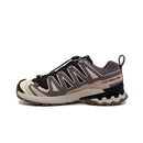 A side view of the Salomon Womens XA Pro 3D V9 GORE-TEX Trail Shoe in gray and black with lime green accents, a chunky sole for technical terrain, zigzag overlays, quick-lace system, and XA PRO 3D GORE-TEX label on the side.