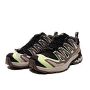 The Salomon Womens XA Pro 3D V9 GORE-TEX Trail Shoe features black, grey, and light green accents, a rugged sole for technical terrain, mesh panels, and a quick-lace system—ideal for outdoor and athletic adventures.