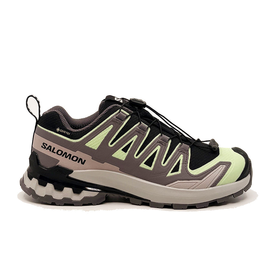 Side view of the Salomon Womens XA Pro 3D V9 GORE-TEX Trail Shoe in light green, black, and gray, with a rugged sole for technical terrain, breathable mesh upper, durable overlays, GORE-TEX waterproofing, and quick-lace system.