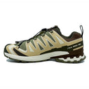 The Salomon Mens XA Pro 3D V9 GORE-TEX Trail Shoe features earth-tone yellow and olive panels, a rugged sole for technical terrain, black heel pull tab, quick-lace system, and XA PRO 3D branding on the side.