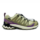 The Salomon Womens XA Pro 3D V9 GORE-TEX Trail Shoe in beige and purple features black accents, a rugged sole for technical terrain, a GORE-TEX waterproof label, and quick-lace system, shown from the side against a white background.