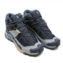 The Salomon Womens X-Ultra 5 Mid GORE-TEX Hiking Boot features a durable Matryx upper, rugged soles, thick laces, and padded collars in black and grey—ideal for outdoor activities.